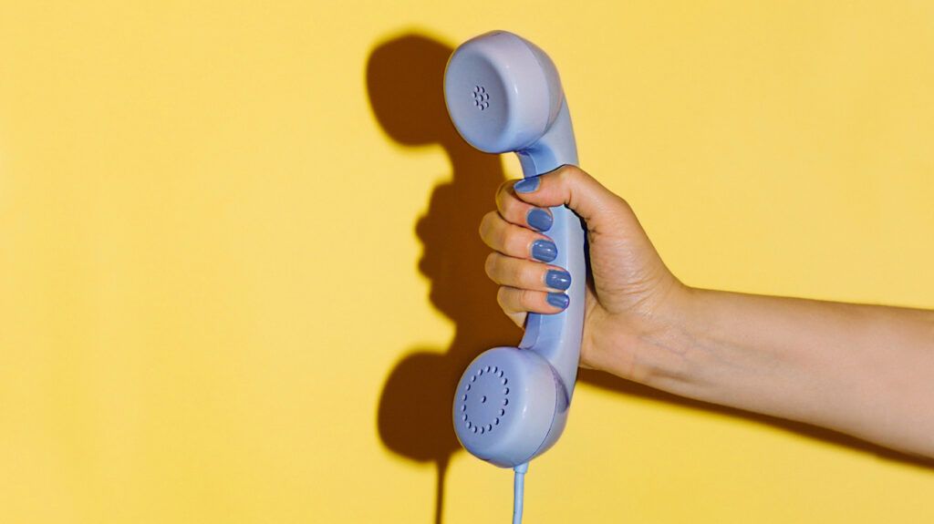hand holding telephone
