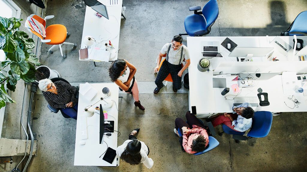 An overhead view of coworkers meeting in an office