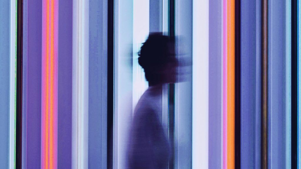 abstract image of person against vertical lines