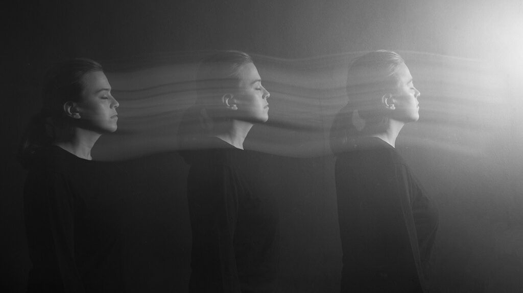 Black and white multiple exposure portrait of woman